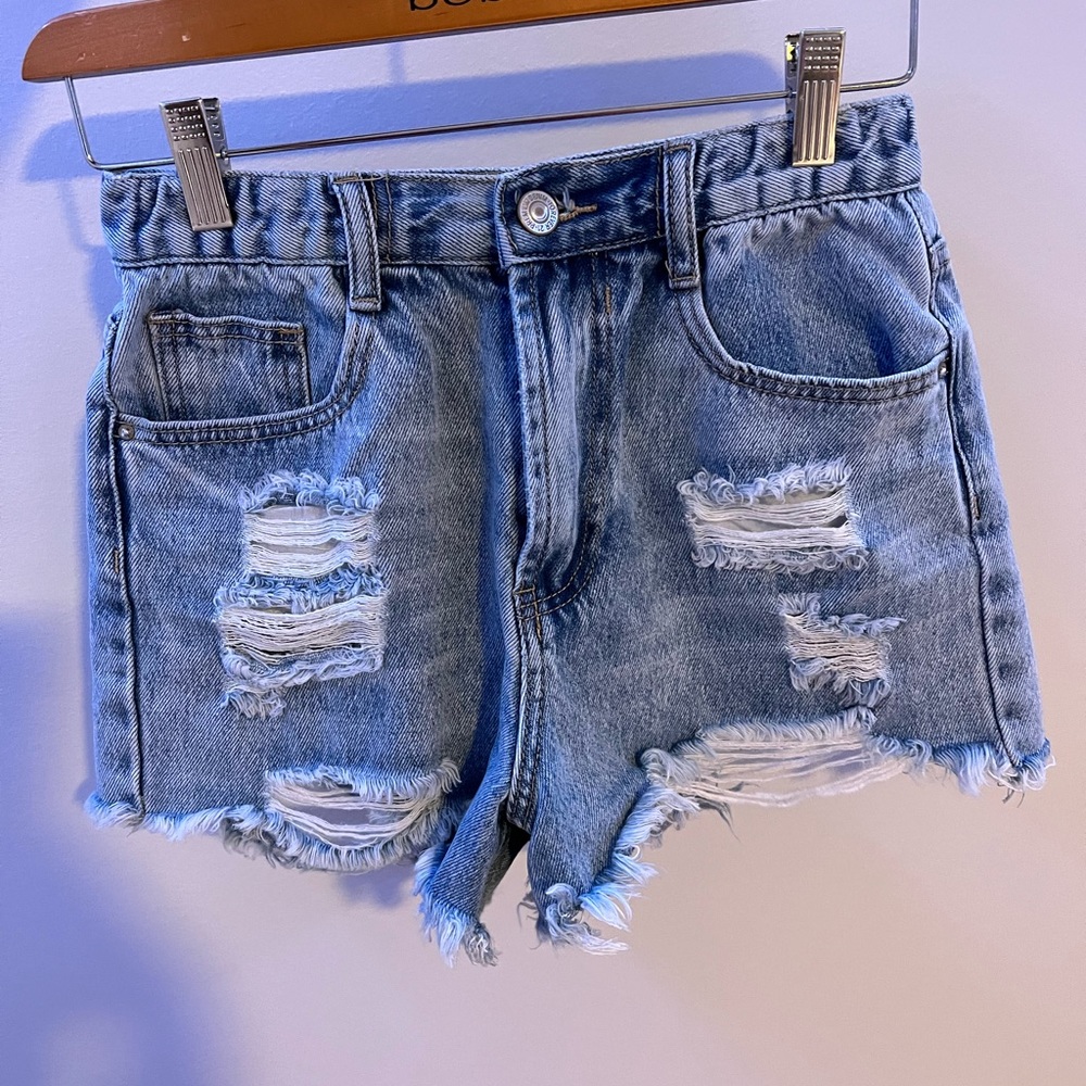 H&M Jean shorts with rips, size s and has not been worn